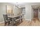 Modern dining area with a grey table and bench, situated near the kitchen and entryway at 7625 E Camelback Rd # B148, Scottsdale, AZ 85251