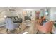 Open living area showcasing a sofa, armchairs, and a view into the dining area and kitchen at 7625 E Camelback Rd # B148, Scottsdale, AZ 85251
