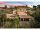 Two-story home with a three car garage and desert landscaping at 7631 N 20Th St, Phoenix, AZ 85020