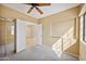 Bedroom with mirrored closet doors and access to another room at 8881 E Meadow Hill Dr, Scottsdale, AZ 85260