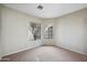 Bedroom with large windows and carpeted floors at 8881 E Meadow Hill Dr, Scottsdale, AZ 85260