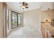 Dining area with tile floor, sliding glass doors, and kitchen access at 8881 E Meadow Hill Dr, Scottsdale, AZ 85260