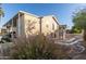 Landscaped backyard with lounge chairs and tall grass at 9333 E University Dr # 110, Mesa, AZ 85207