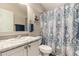 Clean bathroom with patterned shower curtain and updated vanity at 9333 E University Dr # 110, Mesa, AZ 85207