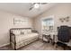 Charming bedroom with daybed, ceiling fan, and window coverings at 9333 E University Dr # 110, Mesa, AZ 85207