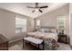Spacious bedroom with a king-size bed and floral bedding at 9333 E University Dr # 110, Mesa, AZ 85207