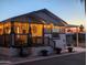 Charming home exterior with a welcoming porch at night at 9333 E University Dr # 110, Mesa, AZ 85207