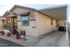 Home exterior view with carport and porch at 9333 E University Dr # 110, Mesa, AZ 85207