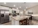 Modern kitchen features white shaker cabinets, granite counters, and stainless steel appliances at 9333 E University Dr # 110, Mesa, AZ 85207