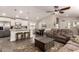 Open concept kitchen and living area with island and seating at 9333 E University Dr # 110, Mesa, AZ 85207