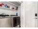 Laundry room with washer, dryer, shelving, and extra storage at 9333 E University Dr # 110, Mesa, AZ 85207