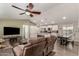 Open living room features a large sectional sofa and TV at 9333 E University Dr # 110, Mesa, AZ 85207