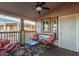 Relaxing covered porch with seating area and decorative rug at 9333 E University Dr # 110, Mesa, AZ 85207