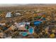 Aerial view of community pool, tennis courts, and clubhouse at 9574 E Chuckwagon Ln, Scottsdale, AZ 85262