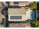 Aerial view showcasing the home's solar panels and pool at 9839 E Theia Dr, Mesa, AZ 85212
