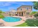 Back exterior showing a pool, patio and well landscaped yard at 9839 E Theia Dr, Mesa, AZ 85212