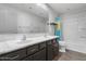 Bathroom with double vanity, shower/tub combo, and tile floor at 9839 E Theia Dr, Mesa, AZ 85212
