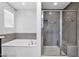 Stylish bathroom showcasing a tiled shower, built in bench, and a relaxing soaking tub at 9839 E Theia Dr, Mesa, AZ 85212