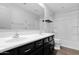 A well-lit bathroom features dual sinks and plenty of storage space in its cabinets at 9839 E Theia Dr, Mesa, AZ 85212