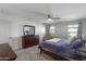 Comfortable bedroom with dresser and window at 9839 E Theia Dr, Mesa, AZ 85212