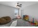 bedroom with beanbag chair, toy shelves, and keyboard at 9839 E Theia Dr, Mesa, AZ 85212