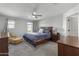 Bright bedroom with a queen-size bed and ample closet space at 9839 E Theia Dr, Mesa, AZ 85212