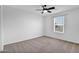 A neutral bedroom provides space, light, and comfort to the home's owner at 9839 E Theia Dr, Mesa, AZ 85212