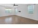 Spacious bedroom with a ceiling fan, and plenty of natural light from large windows at 9839 E Theia Dr, Mesa, AZ 85212