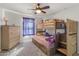 Bedroom with bunk beds, dresser, and window coverings at 9839 E Theia Dr, Mesa, AZ 85212