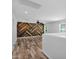 Light-filled bonus room features chevron accent wall, ceiling fan, and modern flooring at 9839 E Theia Dr, Mesa, AZ 85212