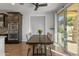 Bright dining area with wooden table and access to backyard at 9839 E Theia Dr, Mesa, AZ 85212