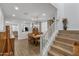 Open dining room with wood flooring and staircase at 9839 E Theia Dr, Mesa, AZ 85212