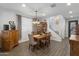 Formal dining room with antique furniture and staircase view at 9839 E Theia Dr, Mesa, AZ 85212