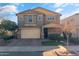 Two-story home with neutral exterior, two-car garage, and landscaping at 9839 E Theia Dr, Mesa, AZ 85212