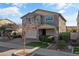Two-story home with neutral exterior, two-car garage, and landscaping at 9839 E Theia Dr, Mesa, AZ 85212