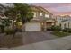 Two-story home with neutral exterior, two-car garage, and landscaping at 9839 E Theia Dr, Mesa, AZ 85212