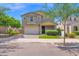 Charming two-story home with a well-manicured lawn and attached two-car garage at 9839 E Theia Dr, Mesa, AZ 85212