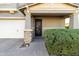 Modern front door with black metal design and stone accents at 9839 E Theia Dr, Mesa, AZ 85212