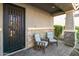 Cozy front porch with two chairs and a welcome mat at 9839 E Theia Dr, Mesa, AZ 85212
