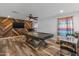 Game room features a pool table, TV, and arcade game at 9839 E Theia Dr, Mesa, AZ 85212