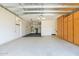 Spacious two-car garage features epoxy flooring, built in storage and work space at 9839 E Theia Dr, Mesa, AZ 85212