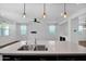 Island sink boasts stainless steel fixtures and quartz countertop in this modern, bright space at 9839 E Theia Dr, Mesa, AZ 85212