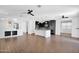 Open-concept kitchen featuring modern appliances, a center island, and seamless flow to other living spaces at 9839 E Theia Dr, Mesa, AZ 85212