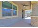 Covered patio featuring neutral tones, ceiling fan, and views of the backyard at 9839 E Theia Dr, Mesa, AZ 85212