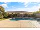 Stunning kidney shaped pool with water features and lush landscaping at 9839 E Theia Dr, Mesa, AZ 85212