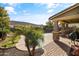 Covered patio overlooking a kidney shaped pool and fire pit at 9839 E Theia Dr, Mesa, AZ 85212