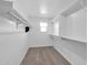 A well organized walk-in closet, with shelving and neutral carpeting, provides storage at 9839 E Theia Dr, Mesa, AZ 85212