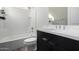 Clean bathroom with tub, toilet, and dark vanity at 10032 E Toledo Ave, Mesa, AZ 85212