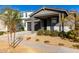 Modern single story home with gray siding, white accents and a covered porch at 10032 E Toledo Ave, Mesa, AZ 85212