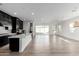 Modern kitchen featuring dark cabinetry, quartz countertops, and stainless steel appliances at 10032 E Toledo Ave, Mesa, AZ 85212